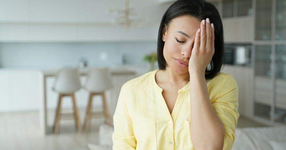 Facepalm, oh no. Upset female cover face with palm, feel regret blaming herself for failure at home